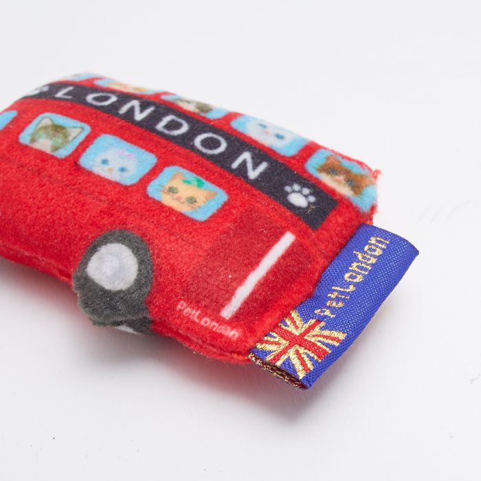 A wide angle shot of a cat toy that looks like a London bus